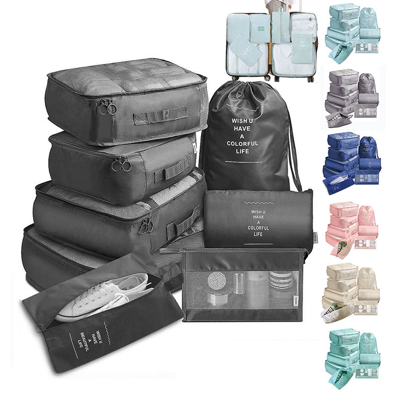 Collection of travel packing bags and organizers with various items inside on a white background.