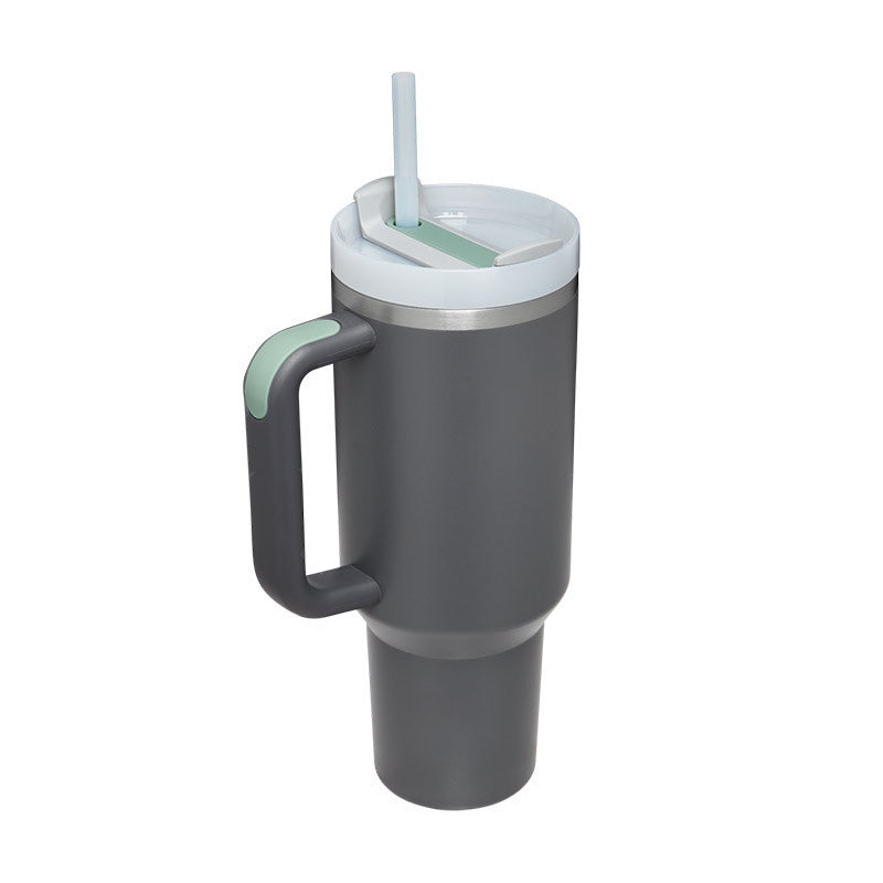 Gray insulated mug with handle and straw lid on a white background